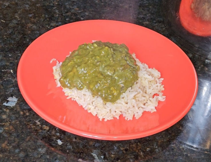 saag on top of white rice